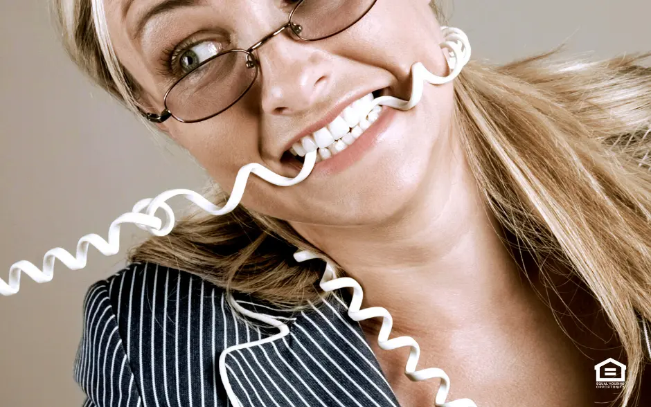 Woman with phone cord wrapped around her head