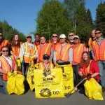 Real Property Management employees picking up trash.