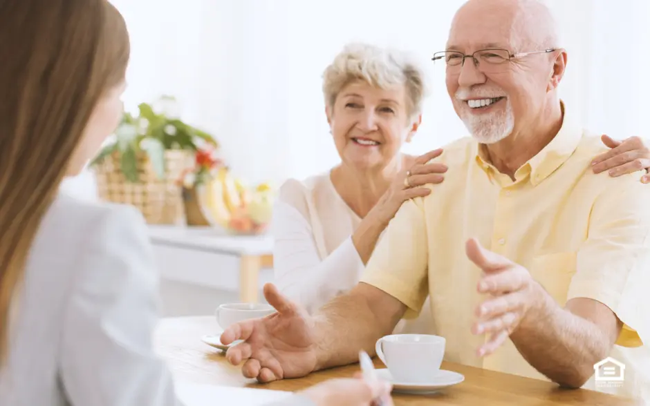 Elderly couple in business meeting