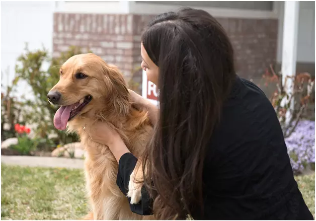 woman petting her dog