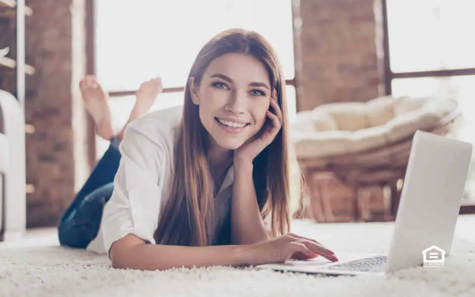 Woman lying on carpet in rental property