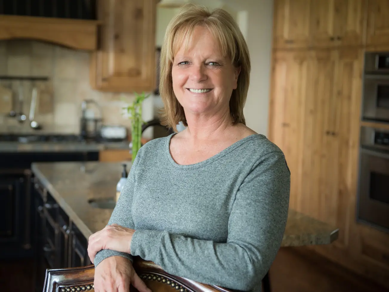 Woman smiling in kitchen