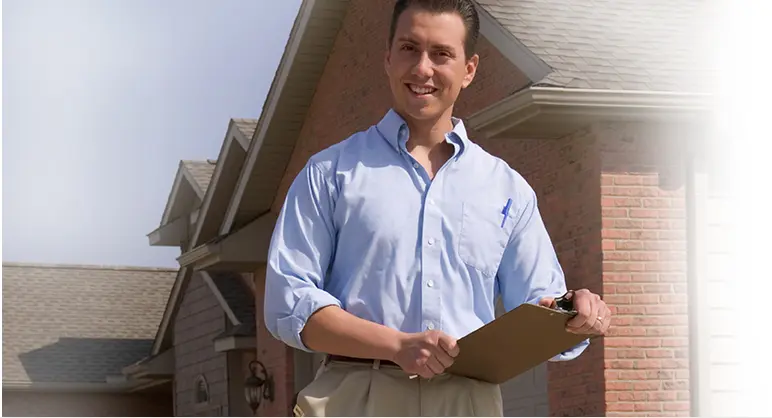 Man Smiling and Holding Clipboard